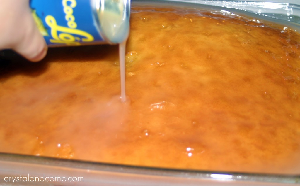 pour cream of coconut over baked cake