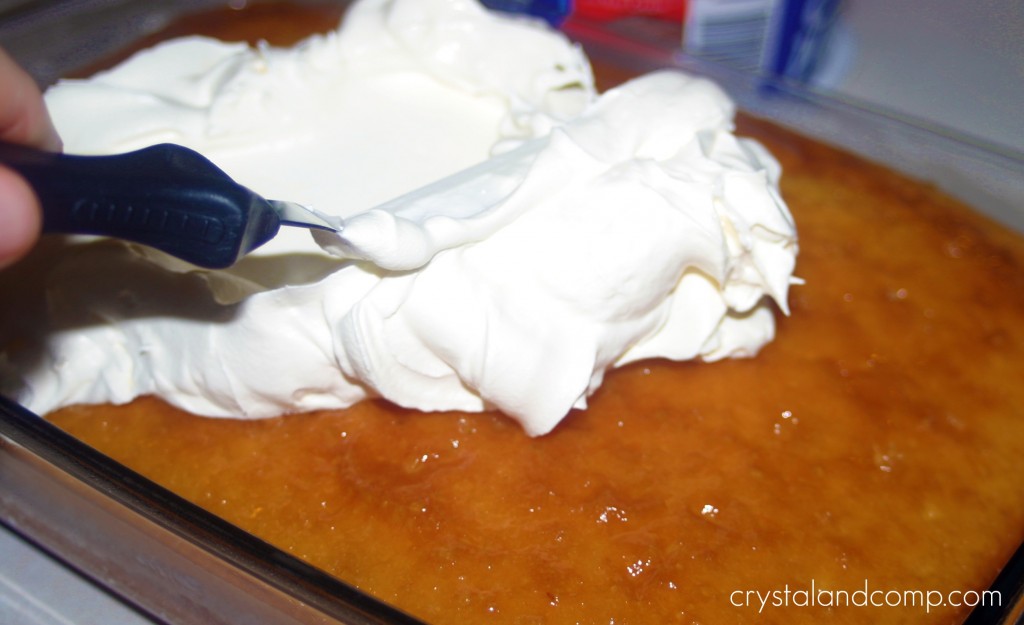 spread whipped cream over the cake