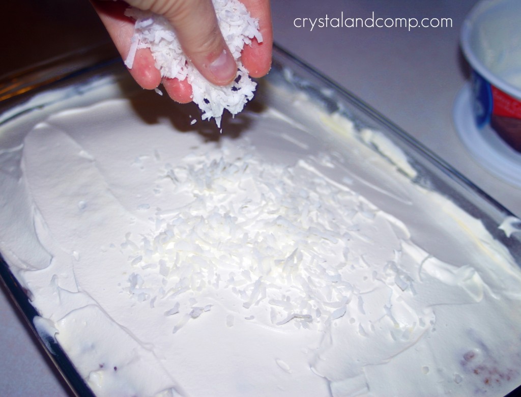 sprinkle coconut over the cake