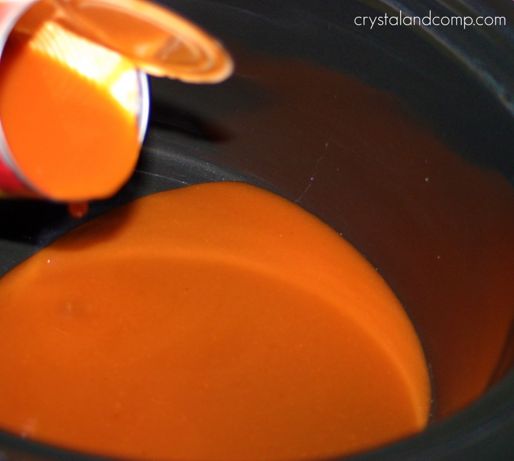 add enchilada sauce to bottom of crockpot
