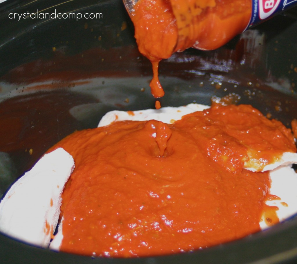 pour spaghetti sauce over the chicken