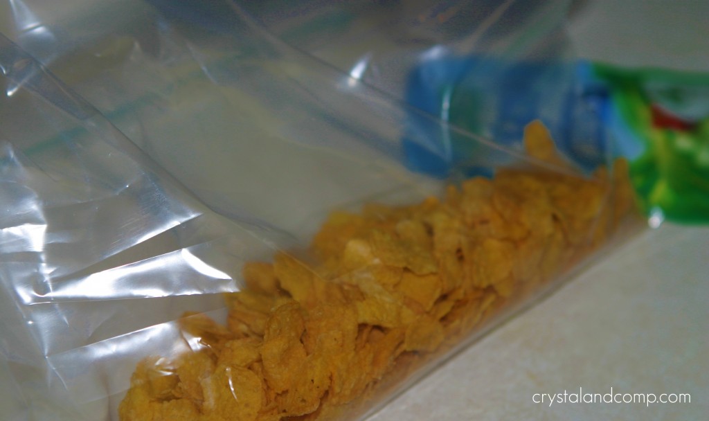 crush cornflakes in a ziplock bag