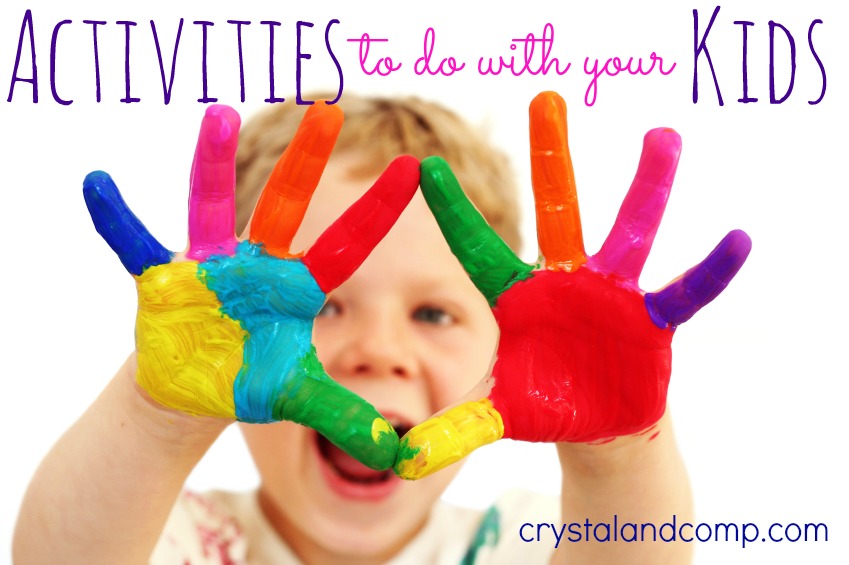 activities for kids Five year old boy with hands painted in colorful paints ready for hand prints